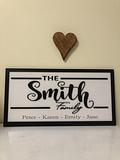 Smith family name sign with heart on top