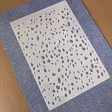 image of a cake stencil with a terrazzo pattern